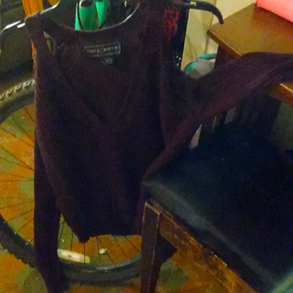 This is a long sleeve shoulder showing sweater top and it is purple so cute tren